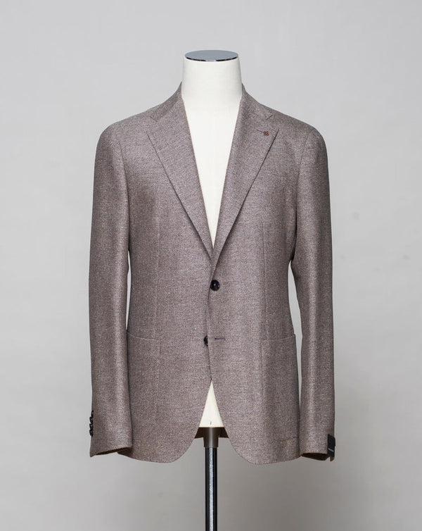 <div>Hopsack jersey jacket from Sauma 20 anniversary capsule collection. Crafted in Martina Franca, Italy by Tagliatore.</div> <ul class="ul1"> <li>Natural stretch hopsack jersey jacket</li> <li>Composition: 72% Silk 28% Virgin wool</li> <li>Modello: Monte Carlo / 1SMC22K</li> <li>Color: Taupe / T1253</li> <li>Unconstructed shoulder</li> <li>Unlined</li> <li>2 Buttons</li> <li>Notch lapel</li> <li>Patch pockets</li> <li>Side vents</li> <li>Made in Martina Franca, Italy</li> </ul>