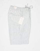 Article: 324118. Color: Light Grey / 40. Composition: 100% Linen. Single pleat. Slanted side pockets. Drawstring. Made in Naples, Italy