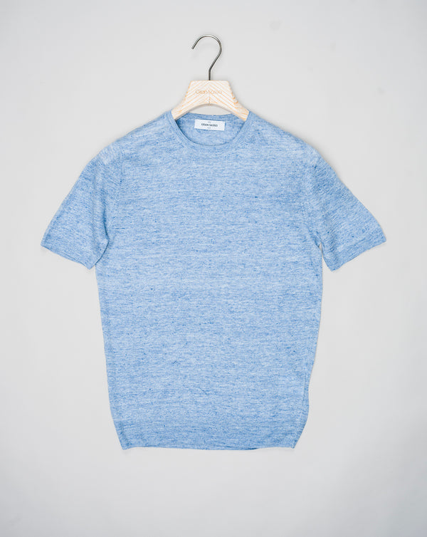 Indulge in luxury with Gran Sasso Knitted Linen T-Shirt. Made from high-quality knitted linen, this t-shirt offers a comfortable yet sophisticated fit. The perfect addition to your wardrobe for a touch of elegance and style.<ul> <li>Composition: 100% Linen</li> <li>Color: 510 / Light Blue</li> <li>Article: 57177 / 24801</li> <li>Made in Italy</li> </ul>