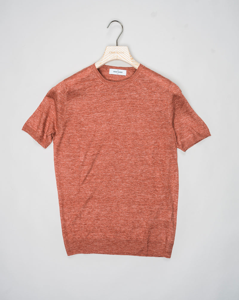 Indulge in luxury with Gran Sasso Knitted Linen T-Shirt. Made from high-quality knitted linen, this t-shirt offers a comfortable yet sophisticated fit. The perfect addition to your wardrobe for a touch of elegance and style.<ul> <li>Composition: 100% Linen</li> <li>Color: 350 / Burned Red</li> <li>Article: 57177 / 24801</li> <li>Made in Italy</li> </ul>