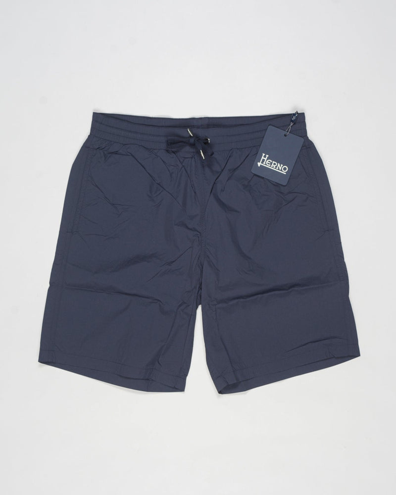 Swim shorts in ultra-lightweight, breathable stretch nylon.
Boasting a classic shape and elasticated waist for maximum comfort, this model combines style and functionality to enhance your casual wardrobe.




Regular fit

Elastic with drawstring waist

Side pockets

Patch pocket on the back
Color: 9201 / Navy
Article: CST00002U 12691Z