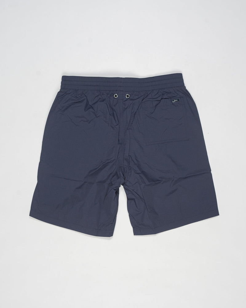 Swim shorts in ultra-lightweight, breathable stretch nylon.
Boasting a classic shape and elasticated waist for maximum comfort, this model combines style and functionality to enhance your casual wardrobe.




Regular fit

Elastic with drawstring waist

Side pockets

Patch pocket on the back
Color: 9201 / Navy
Article: CST00002U 12691Z