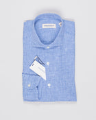 Cutaway collar
Curved hem

100% linen
Art. H9105
Mod. L69
Collar B878
Color: 02 Blue