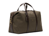 Measurements:  L: 47  H: 29  W: 24cm Body: Tight-woven cotton canvas Fabric composition: CO 94% PU 4% PC 2% - 709 gr/rm Trimmings: Dark brown custom developed vegetable tanned full-grain bridle leather Lining: 100% cotton in army colour  Hardware: Solid brass with varnish protection  Zipper: Hand polished YKK Excella travelling cosmopolitan, the M/S Avail is our latest take on a weekender that seamlessly merges style and function in a compact shape with enough room to easily hold a weekend