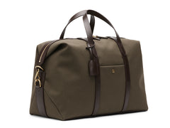 Measurements:  L: 47  H: 29  W: 24cm Body: Tight-woven cotton canvas Fabric composition: CO 94% PU 4% PC 2% - 709 gr/rm Trimmings: Dark brown custom developed vegetable tanned full-grain bridle leather Lining: 100% cotton in army colour  Hardware: Solid brass with varnish protection  Zipper: Hand polished YKK Excella travelling cosmopolitan, the M/S Avail is our latest take on a weekender that seamlessly merges style and function in a compact shape with enough room to easily hold a weekend