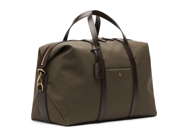 Measurements:  L: 47  H: 29  W: 24cm Body: Tight-woven cotton canvas Fabric composition: CO 94% PU 4% PC 2% - 709 gr/rm Trimmings: Dark brown custom developed vegetable tanned full-grain bridle leather Lining: 100% cotton in army colour  Hardware: Solid brass with varnish protection  Zipper: Hand polished YKK Excella travelling cosmopolitan, the M/S Avail is our latest take on a weekender that seamlessly merges style and function in a compact shape with enough room to easily hold a weekend
