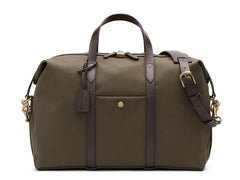 Measurements:  L: 47  H: 29  W: 24cm Body: Tight-woven cotton canvas Fabric composition: CO 94% PU 4% PC 2% - 709 gr/rm Trimmings: Dark brown custom developed vegetable tanned full-grain bridle leather Lining: 100% cotton in army colour  Hardware: Solid brass with varnish protection  Zipper: Hand polished YKK Excella travelling cosmopolitan, the M/S Avail is our latest take on a weekender that seamlessly merges style and function in a compact shape with enough room to easily hold a weekend