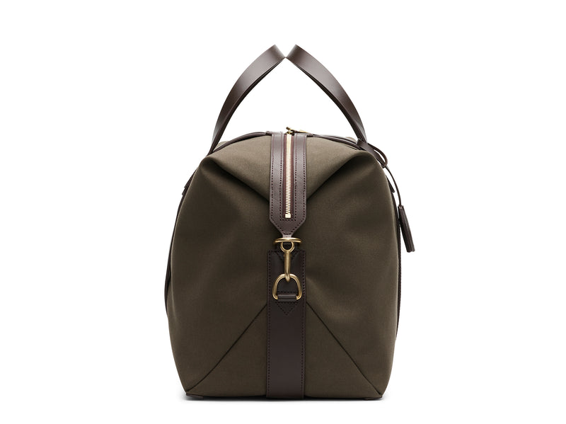 Measurements:  L: 47  H: 29  W: 24cm Body: Tight-woven cotton canvas Fabric composition: CO 94% PU 4% PC 2% - 709 gr/rm Trimmings: Dark brown custom developed vegetable tanned full-grain bridle leather Lining: 100% cotton in army colour  Hardware: Solid brass with varnish protection  Zipper: Hand polished YKK Excella travelling cosmopolitan, the M/S Avail is our latest take on a weekender that seamlessly merges style and function in a compact shape with enough room to easily hold a weekend