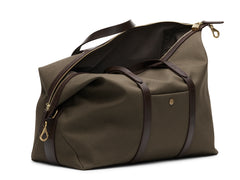 Measurements:  L: 47  H: 29  W: 24cm Body: Tight-woven cotton canvas Fabric composition: CO 94% PU 4% PC 2% - 709 gr/rm Trimmings: Dark brown custom developed vegetable tanned full-grain bridle leather Lining: 100% cotton in army colour  Hardware: Solid brass with varnish protection  Zipper: Hand polished YKK Excella travelling cosmopolitan, the M/S Avail is our latest take on a weekender that seamlessly merges style and function in a compact shape with enough room to easily hold a weekend
