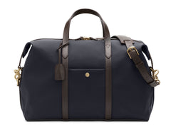 Measurements:   L: 47  H: 29  W: 24cm Body: Hard-woven nylon (waterproof) Fabric composition:  PA 42% CO 38% PU 20% / 826 gr./rm Trimmings: Dark brown custom developed vegetable tanned full-grain bridle leather Lining: 100% cotton in army colour  Hardware: Solid brass with varnish protection  Zipper: Hand polished YKK Excella Art. No. MS861319 Built for the travelling cosmopolitan, the M/S Avail is our latest take on a weekender that seamlessly merges style and function in a compact shape with enough room 