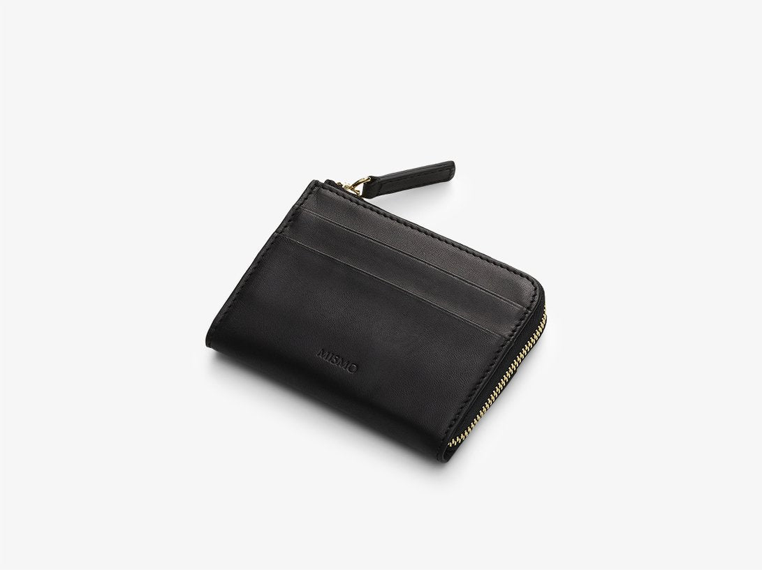 A small and very practical zip wallet with the cardholders placed on the outside of large internal compartment that can be used just as easily for credit cards and receipts as for coins and cash notes. Has a gusset underlay in leather to prevent the wallet from opening more than 90 degrees L: 10,2   H: 8   W: 2cm Body: Vegetable tanned full-grain cow leather Vegetable tanned full-grain cow leather Cotton/nylon stripe lining in off white/anthracite Zipper: YKK Excella Art. No. FG040118