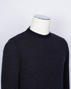 Crew neck 100% merino wool micro spotknit from G.R.P. Firenze. Spotknit is already a icon quality for G.R.P. and is a stable in our knitwear range.  100% Merino Wool  Long sleeves Art. SF TEC 2/14 BICOLOR  Col. Blu Notte / Antracite