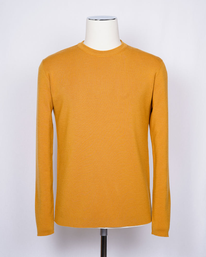 Crew neck 100% merino wool knit from G.R.P. Firenze. Straight hem and sleeve. Quite heavy quality and clean lines for calm elegance.   G.R.P. have their own size standards. Please see below:   100% Merino Wool  Long sleeves Art. SF TEC 55 Col. Ocra / Yellow