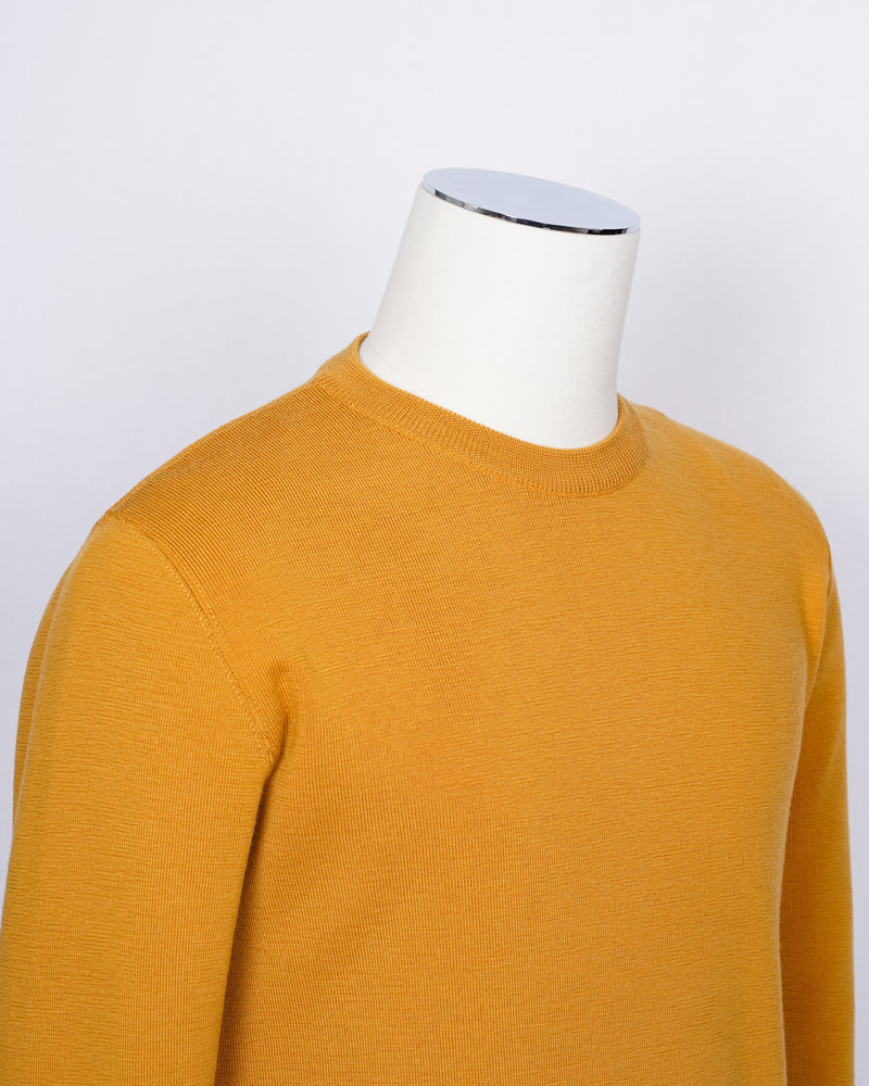 Crew neck 100% merino wool knit from G.R.P. Firenze. Straight hem and sleeve. Quite heavy quality and clean lines for calm elegance.   G.R.P. have their own size standards. Please see below:   100% Merino Wool  Long sleeves Art. SF TEC 55 Col. Ocra / Yellow