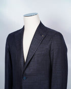 Composition: 90% Wool, 10% SIlk Oxygen Color: BLUE GREY MELANGE Modello: Montecarlo / 1SMC22K Article: 03UEG110 Colore: B3073 Slim fit. Take your normal size Unlined Unconstructed shoulder 2 Buttons Side vents Notch lapel Patch pockets Made in Italy tagliatore