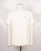 C.P. Company polo shirt in a short sleeve construction, featuring a two button placket, a classic collar, and the C.P. Company logo at the chest.  CP COMPANY Polo Short Sleeve MPL067A005263W Col. 103 Gauze White Composition: 100% cotton Classic Collar Two Button Placket Short Sleeves Embroidered Logo at Chest