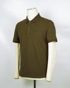C.P. Company polo shirt in a short sleeve construction, featuring a two button placket, a classic collar, and the C.P. Company logo at the chest.  CP COMPANY Polo Short Sleeve MPL067A005263W Col. 683 Ivy Green Composition: 100% cotton Classic Collar Two Button Placket Short Sleeves Embroidered Logo at Chest