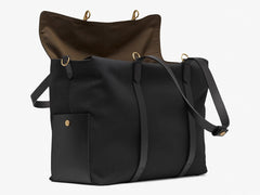 Measurements: L: 46 H: 34 W:18 cm Body: Water-repellent cotton and nylon blended canvas Fabric Comp.: PA 47% PL 20% CO 20% PC 6% PU 7% / 812 gr./rm. Trimmings: Black vegetable tanned full-grain bridle leather Lining: 100% cotton in Army colour Hardware: Solid brass w. varnish protection Zipper: Hand Polished YKK Excella Art No. MS116418 travel bag, or bend flaps down for a large, open city tote bag. A full-grain leather pocket on each gusset adds extra durability to the bottom corners.