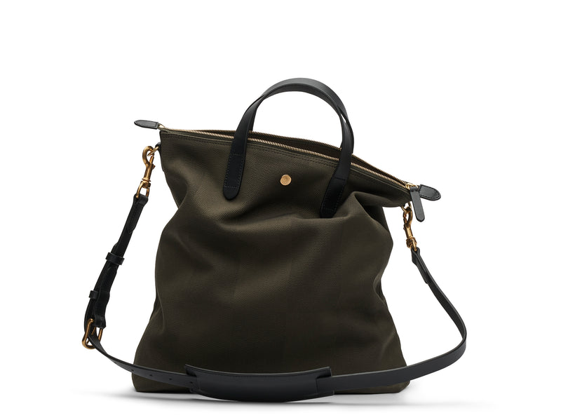 Measurements:  L: 37 x H: 41 x W: 10 cm Fabric composition:PA 12% CO 40% PL 48% - 810 gr/rm Body: Jacquard woven cotton canvas Trimmings:  Black, Vegetable tanned full-grain bridle leather  Lining: 100% cotton in army colour Hardware: Solid brass with varnish protection  Zipper: Hand polished YKK Excella As the first style ever launched in the Contemporary collection, the M/S Shopper has grown to become one of the most iconic styles of the Mismo 