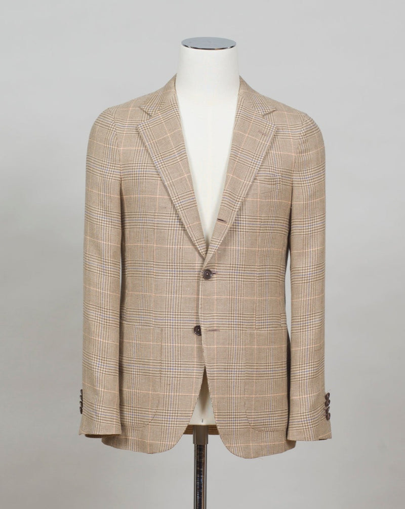 Soft shoulders and comfortable fit like only Naepolitans can do. Here you have the best of both worlds - sharp look and super comfortable fit.  Half lined Unconstructed shoulder 3 roll 2 Buttoning Side vents Notch lapel Patch pockets Composition: 66% Linen 34% Cotton Lining: 100% CU Color: 1600 / Sand Linea: Gaiola Modello: GJ02 Article: TS22141/1600 Made in Naples, Italy