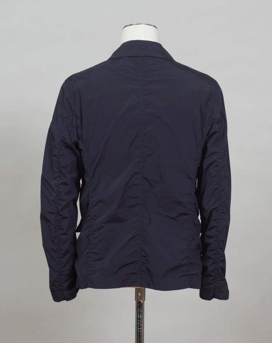 ed into a fibre fine enough to be used to weave Nycra.   CP Blazer  Nycra R MBZ250A00 5864G 888 Total Eclipse / Dark Blue 2 way zip + press studs in front 4 pockets in front with snap stud fastening Zippered pocket on left sleeve with C.P. Lens detailing Garment Dyed Quick Dry Stretch Multi filament