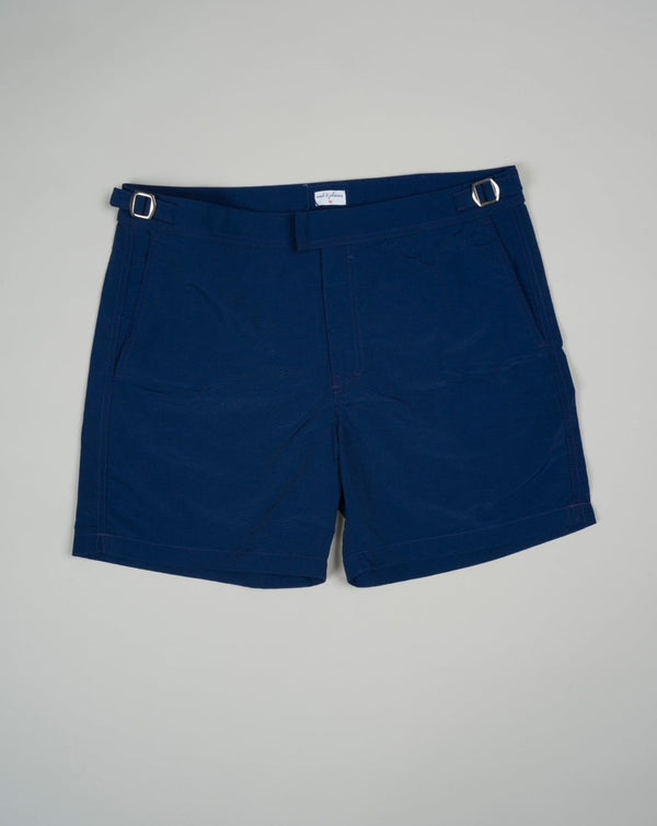 Slim fit Fits true to the size. If in doubt of your size, please contact us HERE 100% Polyamide Color: Navy Side Adjusters Two side pockets and one back pocket Made in Portugal Seersucker swim trunks with side adjusters.