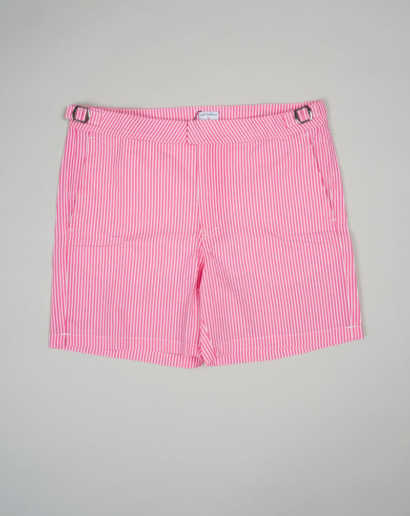 Slim fit Fits true to the size. If in doubt of your size, please contact us HERE 55% Polyamide 45% Cotton Color: Pink Side Adjusters Two side pockets and one back pocket Made in Portugal Seersucker swim trunks with side adjusters.  The weave of seersucker fabric gives it a distinctive gentle wrinkled look.