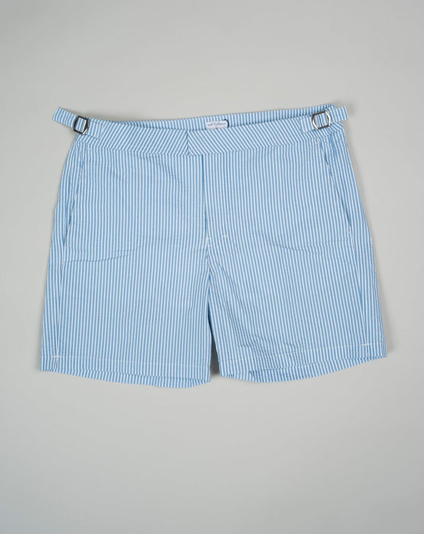 Slim fit Fits true to the size. If in doubt of your size, please contact us HERE 55% Polyamide 45% Cotton Color: Light Blue Side Adjusters Two side pockets and one back pocket Made in Portugal Seersucker swim trunks with side adjusters.  The weave of seersucker fabric gives it a distinctive gentle wrinkled look. 