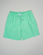 Slim fit Fits true to the size. If in doubt of your size, please contact us HERE 55% Polyamide 45% Cotton Color: Green Drawstring Two side pockets and one back pocket Made in Portugal Seersucker swim trunks with adjustable drawstring waistband.  The weave of seersucker fabric gives it a distinctive gentle wrinkled look