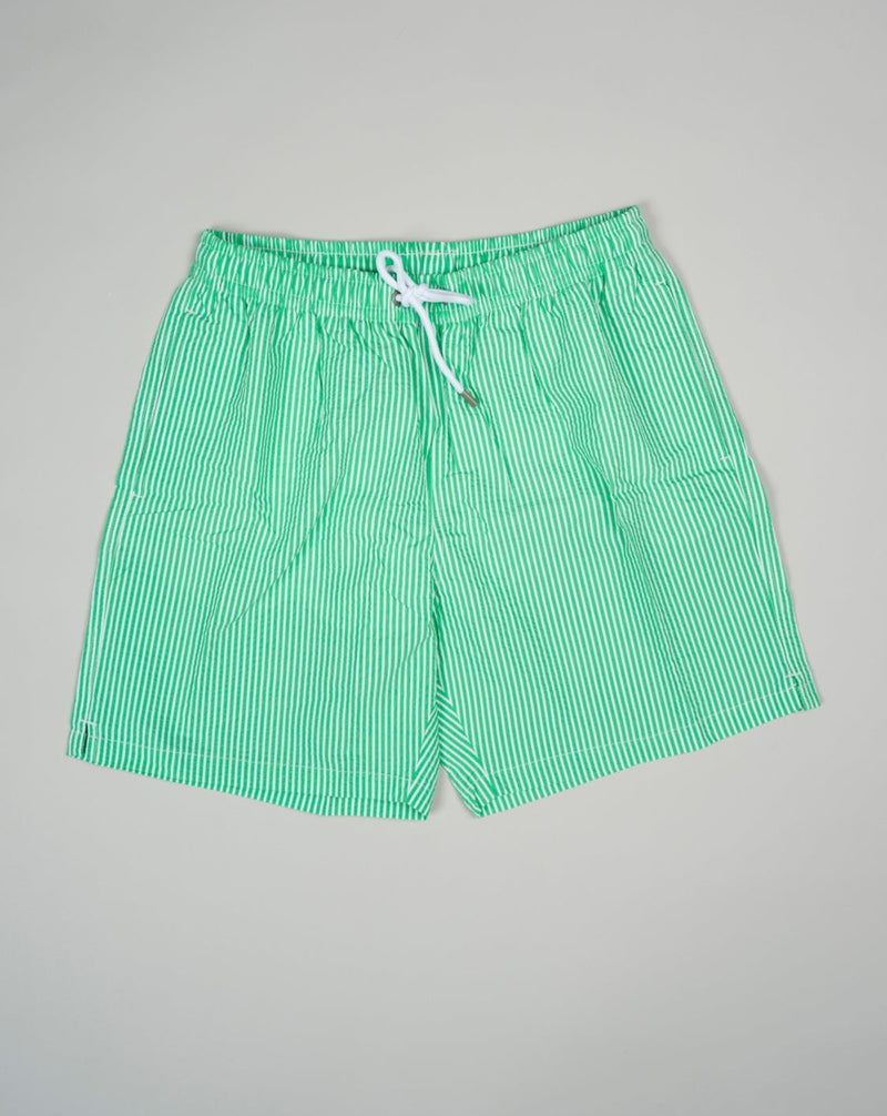 Slim fit Fits true to the size. If in doubt of your size, please contact us HERE 55% Polyamide 45% Cotton Color: Green Drawstring Two side pockets and one back pocket Made in Portugal Seersucker swim trunks with adjustable drawstring waistband.  The weave of seersucker fabric gives it a distinctive gentle wrinkled look