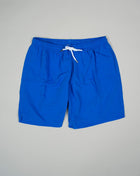 Basic swim trunks with adjustable drawstring waistband. Slim fit Fits true to the size. If in doubt of your size, please contact us HERE 100% Polyamide Color: Bright Blue Drawstring Two side pockets and one back pocket Made in Portugal