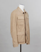 Light field jacket made of soft goatskin suede and napped inside. Four flap pockets in front and adjustable draw string on the waist. Super soft leather and light tone in color together make a truly luxurious interpretation of a field jacket.  100% goatskin suede, napped inside Body: unlined, sleeve lining: 100% polyamide Metal buttons with embossed logo Four large flap pocket Inside pockets Mod: 91 1501 ZN 222