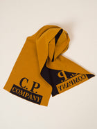  C.P. Company logo scarf.  Breathable 60% Wool 40% Acrylic Art. 11CMAC345A005292J Color:  436 / Desert Sun / Orange One Size