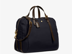 Measurements:   L: 47  H: 42  W: 31 (12) cm Body: Waterproof hard woven Italian nylon  Fabric composition: PA 42%  CO 38%  PU 20%   /   826 g/m Trimmings: Dark brown custom developed vegetable tanned full-grain bridle leather Lining: 100% cotton in navy colour  Hardware: Solid brass with varnish protection  Zipper: Hand polished YKK Excella The perfect holdall for the active lifestyle. The M/S Something easily does the job for any trip 