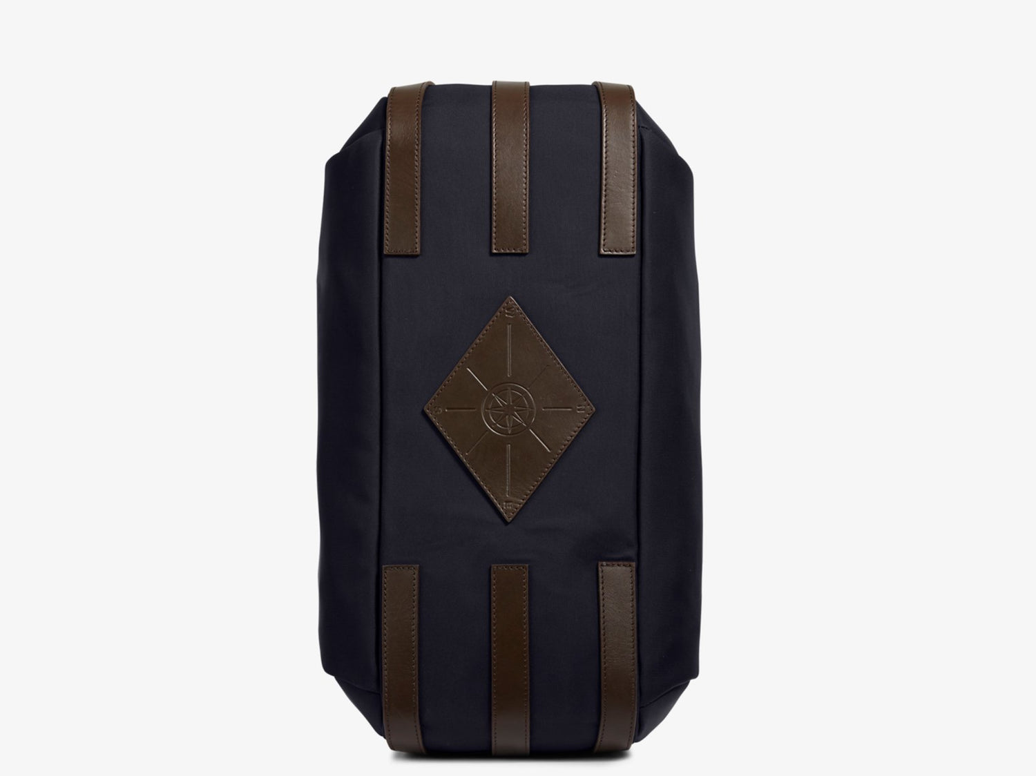Measurements: L: 47 H: 42 W: 31 (12) cm Body: Waterproof hard woven Italian nylon Fabric composition: PA 42% CO 38% PU 20% / 826 g/m Trimmings: Dark brown custom developed vegetable tanned full-grain bridle leather Lining: 100% cotton in navy colour Hardware: Solid brass with varnish protection Zipper: Hand polished YKK Excella The perfect holdall for the active lifestyle. The M/S Something easily does the job for any trip