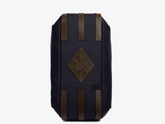 Measurements: L: 47 H: 42 W: 31 (12) cm Body: Waterproof hard woven Italian nylon Fabric composition: PA 42% CO 38% PU 20% / 826 g/m Trimmings: Dark brown custom developed vegetable tanned full-grain bridle leather Lining: 100% cotton in navy colour Hardware: Solid brass with varnish protection Zipper: Hand polished YKK Excella The perfect holdall for the active lifestyle. The M/S Something easily does the job for any trip