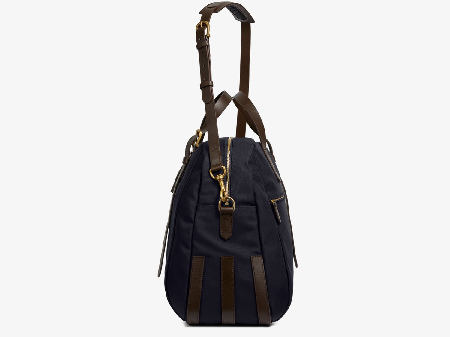 Measurements: L: 47 H: 42 W: 31 (12) cm Body: Waterproof hard woven Italian nylon Fabric composition: PA 42% CO 38% PU 20% / 826 g/m Trimmings: Dark brown custom developed vegetable tanned full-grain bridle leather Lining: 100% cotton in navy colour Hardware: Solid brass with varnish protection Zipper: Hand polished YKK Excella The perfect holdall for the active lifestyle. The M/S Something easily does the job for any trip