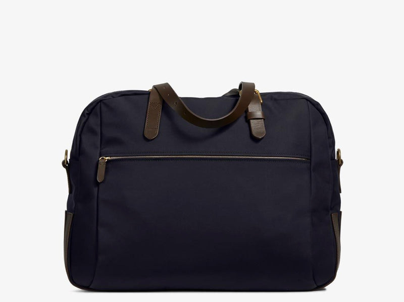 Measurements: L: 47 H: 42 W: 31 (12) cm Body: Waterproof hard woven Italian nylon Fabric composition: PA 42% CO 38% PU 20% / 826 g/m Trimmings: Dark brown custom developed vegetable tanned full-grain bridle leather Lining: 100% cotton in navy colour Hardware: Solid brass with varnish protection Zipper: Hand polished YKK Excella The perfect holdall for the active lifestyle. The M/S Something easily does the job for any trip
