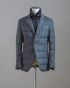 Montecore Reda Active Flannel Down Jacket. Made of entirely traceable ZQ-certified Merino wool.   100% Merino wool upper 90% Down 10% Feather filling Removable bib Zippered side pocket Art. F03MUCX504 Col. 202 / Grey