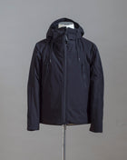 C.P. Company Pro-Tek Hooded Jacket that combines the weight and comfort of a sweatshirt with the protective functions of an outer layer. Water resistant coating on the upper layer of the jacket. Art. 13CMOW025A 004117A Col. 999 / Black Zippered pocket  Pocket with C.P. Company Lens on the left arm Adjustable hood and hem Water resistant