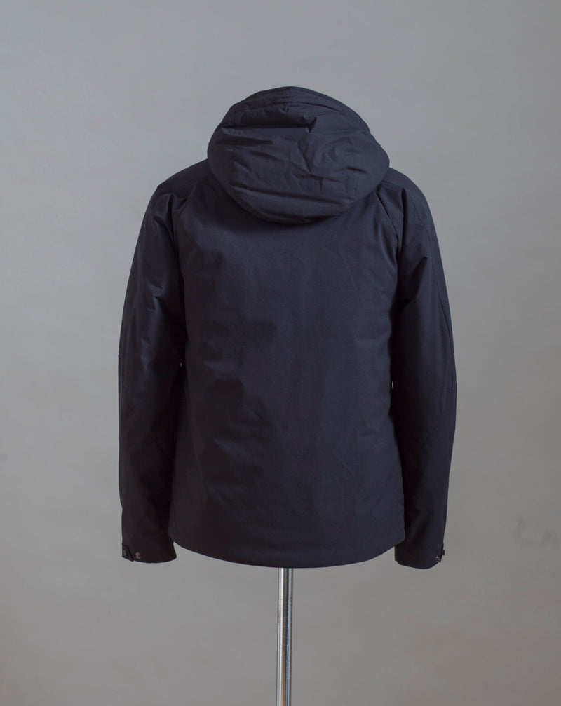 C.P. Company Pro-Tek Hooded Jacket that combines the weight and comfort of a sweatshirt with the protective functions of an outer layer. Water resistant coating on the upper layer of the jacket. Art. 13CMOW025A 004117A Col. 999 / Black Zippered pocket  Pocket with C.P. Company Lens on the left arm Adjustable hood and hem Water resistant