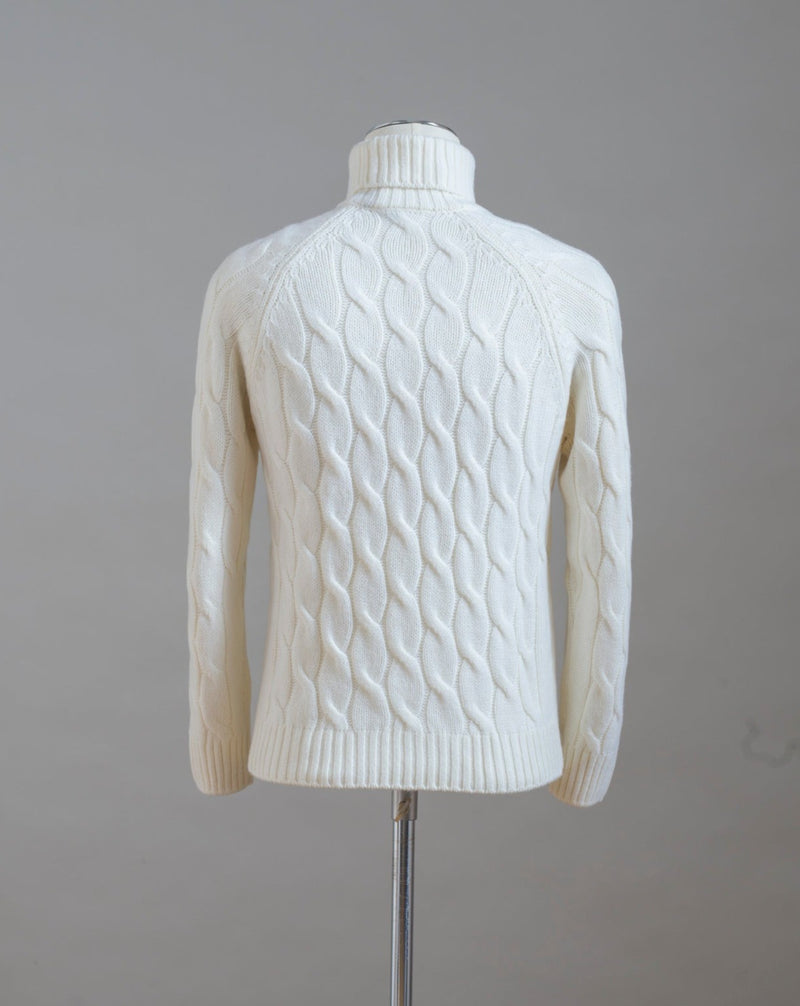 Gran Sasso cable knit roll neck made of special 3-ply Air Wool quality. The special feature of this garment is the yarn that holds microscopic air bubbles between the fibers, making it at the same time warm and light.  Art.  13117/22622 Col.  005 / Natural White 100% Wool Made in Italy 