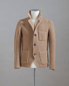 Heavy ribbed jacket made of 5-Ply Super Geelong wool. Geelong wool has as soft touch as cashmere, yet it is remarkably durable. Elegant, comfortable and practical wool quality, perfect for a chunky garment like this.  100% Geelong wool 3 Patch pockets 3 Buttons Mod.  10166/25028 Col. 116 / Beige Made i Italy
