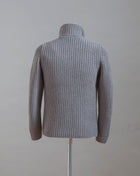 Heavy ribbed jacket made of 5-Ply Super Geelong wool. Geelong wool has as soft touch as cashmere, yet it is remarkably durable. Elegant, comfortable and practical wool quality, perfect for a chunky garment like this.  100% Geelong wool 3 Patch pockets 3 Buttons Mod.  10166/25028 Col. 017 / Taupe (brown-gray) Made i Italy