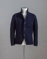 Heavy ribbed jacket made of 5-Ply Super Geelong wool. Geelong wool has as soft touch as cashmere, yet it is remarkably durable. Elegant, comfortable and practical wool quality, perfect for a chunky garment like this.  100% Geelong wool 3 Patch pockets 3 Buttons Mod.  10166/25028 Col. 598 / Navy Made i Italy