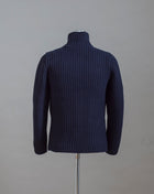 Heavy ribbed jacket made of 5-Ply Super Geelong wool. Geelong wool has as soft touch as cashmere, yet it is remarkably durable. Elegant, comfortable and practical wool quality, perfect for a chunky garment like this.  100% Geelong wool 3 Patch pockets 3 Buttons Mod.  10166/25028 Col. 598 / Navy Made i Italy