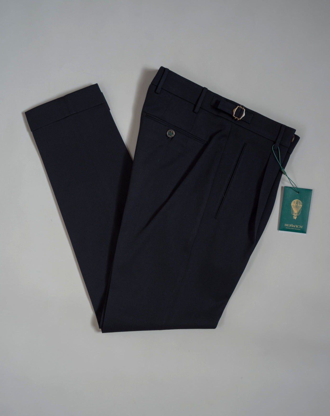 Berwich model Retrolong pants with 1 pleat in front and side adjusters. Very up-to-date and comfortable model; nicely roomy upper part and slim in the bottom. Color: Navy Model: Retrolong Article: sb1201 70% Wool 30% Cotton. Natural stretch.  Made in Martina Franca, Italy