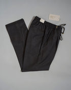 Wool flannel drawstring trousers by Briglia 1949. Next level comfort and style in one package. Fits true to the size. If in doubt of your size, please contact us HERE Single pleat 100% Wool  Drawstring Slanted side pockets 2 back pockets Plain hem Model: Wimbledons Art: 422129 Col: 00056 / Brown Melangé Made in Naples, Italy