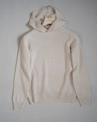 Hooded stitch sweater in Super Geelong wool. A sporty garment that you can match with jeans for an urban look or with jogging-style trousers for a sporty and refined outfit. Geelong wool has as soft touch as cashmere, yet it is remarkably durable. One of the best wool qualities you can find.  Hooded Sweater 100% Wool  Ribbed hem and cuffs Article:  24171/25024 Colore: 054 / Panna Made in Italy