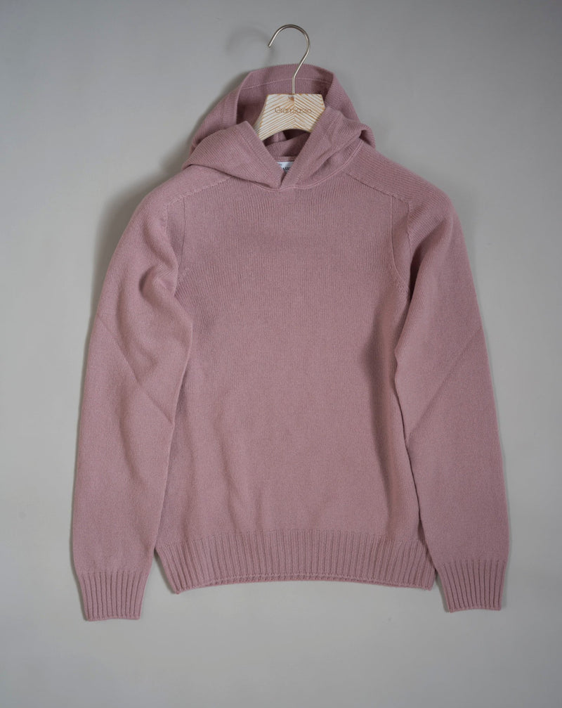 Hooded stitch sweater in Super Geelong wool. A sporty garment that you can match with jeans for an urban look or with jogging-style trousers for a sporty and refined outfit. Geelong wool has as soft touch as cashmere, yet it is remarkably durable. One of the best wool qualities you can find.  Hooded Sweater 100% Wool  Ribbed hem and cuffs Article:  24171/25024 Colore: 207 / Dusty Rosa Made in Italy